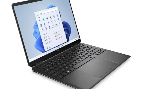 Ordinateur portable HP Spectre, idéal pour une configuration PC pour Photoshop et Lightroom. Son écran affiche Windows 11.