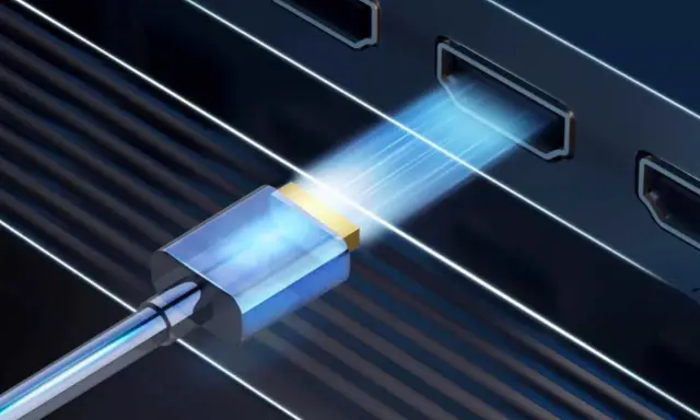 Connexion HDMI pour projeter l'écran de votre PC sur une TV HD. Le câble bleu et or s'insère dans un port, symbolisant le transfert de données.