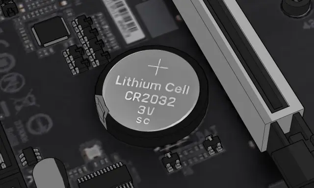 Pile CR2032 sur une carte mère, prête pour un reset BIOS.