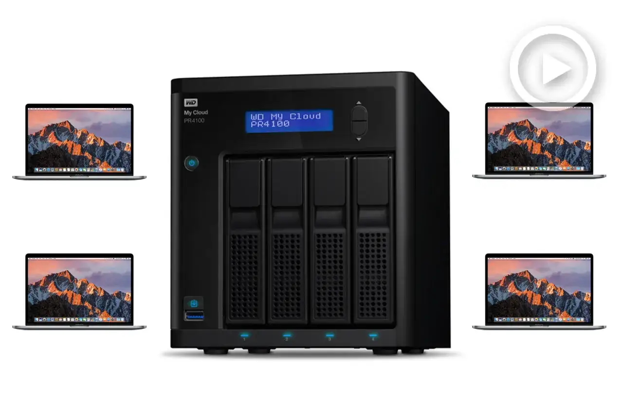 Un serveur maison WD My Cloud PR4100 entouré de quatre ordinateurs portables affichant un paysage montagneux.