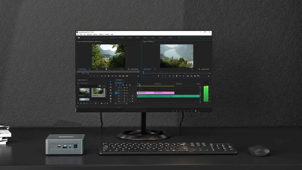 Un ordinateur puissant pour le montage vidéo, avec le logiciel Adobe Premiere Pro affiché à l'écran.